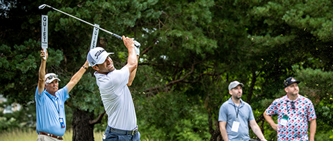 Volunteer holds up quiet signs